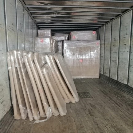 Container interior packed with wrapped freight ready to be sealed for transit